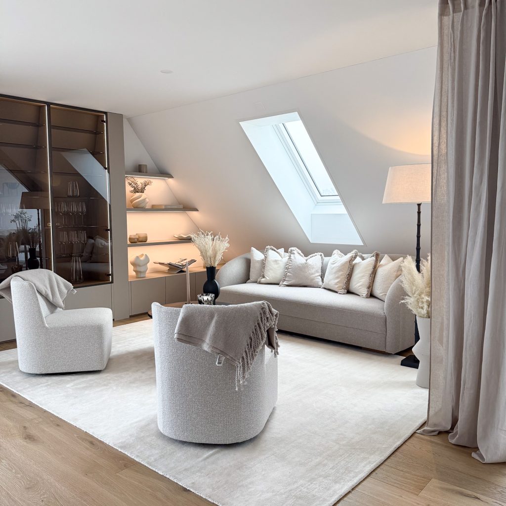 Cozy attic living room with skylight and neutral modern furniture and built in glass cabinet